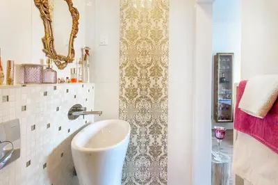 a bathroom with a sink and a mirror at NEW, Stylish and modern central Studio, FREE parking in Celje