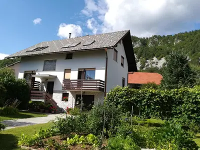 a house with solar panels on the roof at Apartment Ajdna in Žirovnica