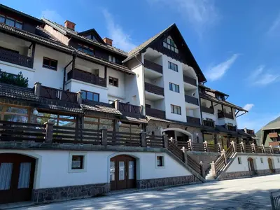 a building with balconies on the side of it at Apartment MIMI in Kranjska Gora