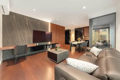 a living room with a couch and a tv at Skyline Luxury Residence Jana in Ljubljana
