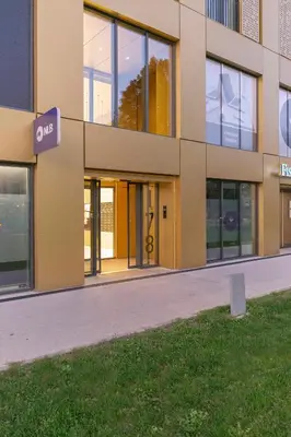 a building with a sign that reads exit at Skyline Luxury Residence Jana in Ljubljana