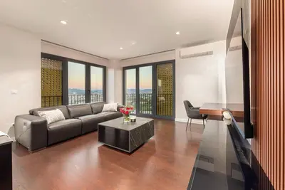a living room with a couch and a table at Skyline Luxury Residence Jana in Ljubljana