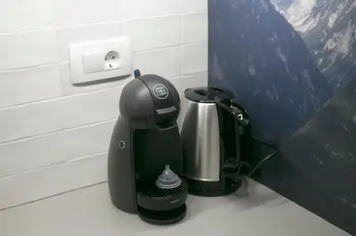 a coffee maker sitting on a counter in a bathroom at Apartma Verdi Bc in Bovec