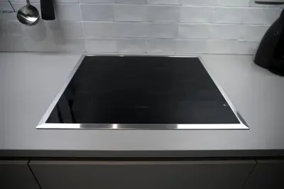 a white counter top with a window in a kitchen at Apartma Verdi Bc in Bovec