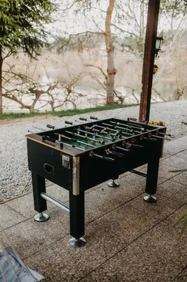 a chess board sitting on top of a sidewalk at Lake House with a View in Šmartno v Rožni Dolini