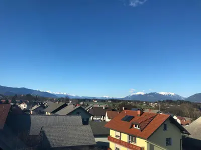 a view of a town with mountains in the background at APARTMA AJDA in Kranj