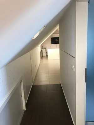 an empty hallway with a staircase in a building at APARTMA AJDA in Kranj