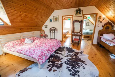 a bedroom with a bed and a wooden ceiling at Authentic Countryside Villa with Hot tub in Veliki Kamen