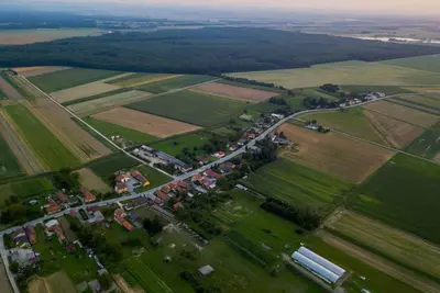 an aerial view of a village in a field at Ranch Kamovci21 in Dobrovnik