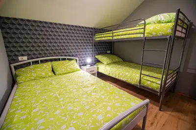 a bedroom with two bunk beds in a room at Holiday Home with Hot tub and Sauna Sabina in Rovte