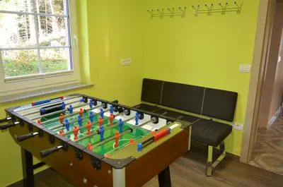 a large foosball table in a room at Holiday Home with Hot tub and Sauna Sabina in Rovte