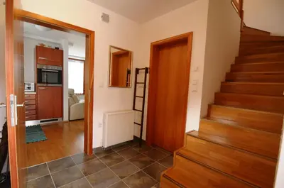 a hallway with a staircase in a house at Pierta Apartment in Bovec
