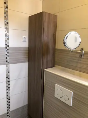 a bathroom with a mirror and a shower at APARTMA CARPE DIEM in Kranjska Gora