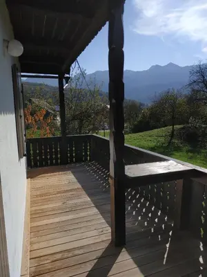 a deck with a view of the mountains at Magical Family Home 84 in Bohinj