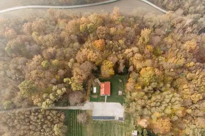 an aerial view of a house in the middle of a forest at Wellness Holiday House Lagev in Moravske Toplice