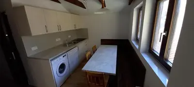 a kitchen with a washing machine and a sink at Appartment Bezenica in Dobrova