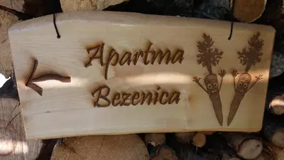 a sign that saysanna beena on a piece of wood at Appartment Bezenica in Dobrova