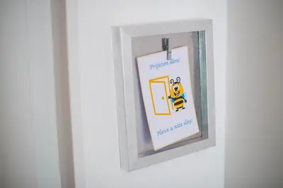 a picture frame with a picture of a bee in a door at ALEX BUMBLEBEE in Bled