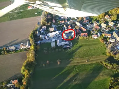 an aerial view of a large house with a red at Apartma Marička in Križe