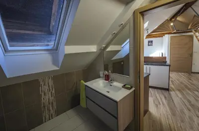 a bathroom with a sink and a mirror at Apartma Marička in Križe