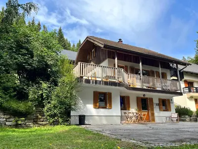 a large house with a balcony on top of it at Chalet Harmony Rogla - apartment in Zreče
