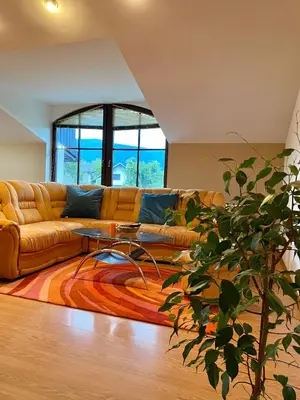 a living room with a couch and a table at Apartma Bernard in Radovljica