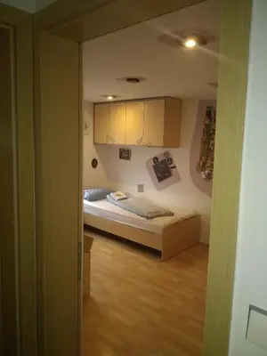 a bedroom with a bed in a room at MichoArt in Ljubljana