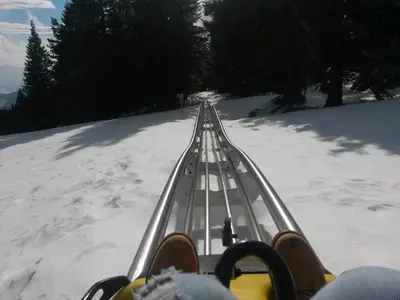 a person on a ski lift in the snow at Apartma Borovnica Rogla in Vitanje