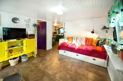 a bedroom with a bed and a tv in a room at Boho House 1 camp Terme Catez with promotional tickets prices in Čatež ob Savi