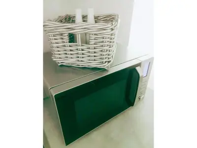 a television with a basket on top of it at Victoria's Place Apartment in Ljubljana
