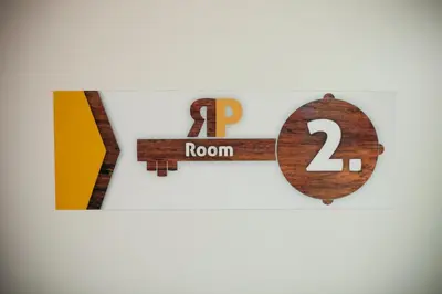 a wooden periodic table with the number of rooms at Rooms Klik Postojna in Postojna