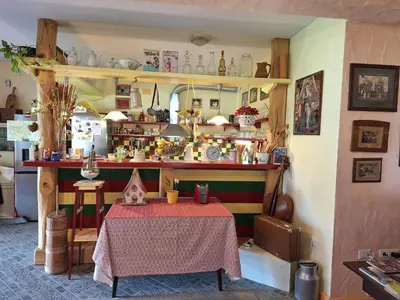 a room with a table with a red table cloth at Rooms Ravnik in Bled