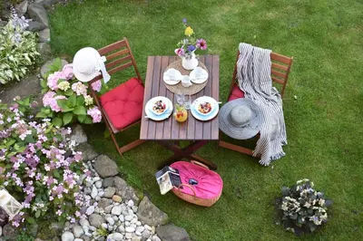 an overhead view of a table and chairs with flowers at Rooms Ravnik in Bled