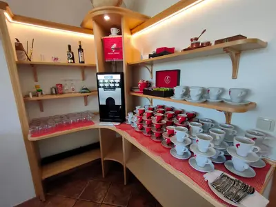 a set of tea cups and saucers on a table at Pension Patrik in Hrušica