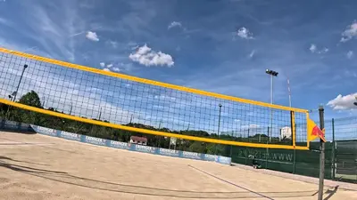 a tennis net on a court with a blue sky at Pension Patrik in Hrušica