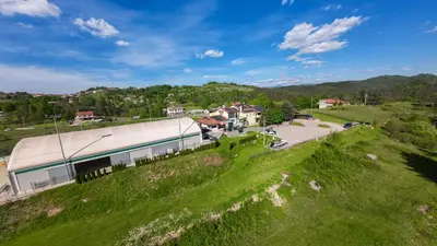 an overhead view of a building on a grassy hill at Pension Patrik in Hrušica