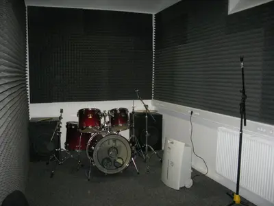 a room with a drum set in a room at Youth Hostel Krško in Krško