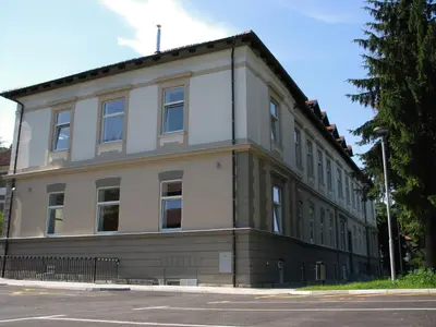 a building on the corner of a street at Youth Hostel Krško in Krško