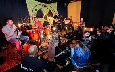 a group of people playing music in front of a crowd at Youth Hostel Krško in Krško