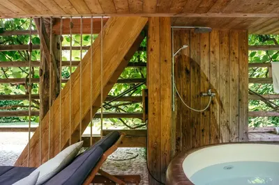 a bathroom with a bath tub and a shower at House Raduha in Luče