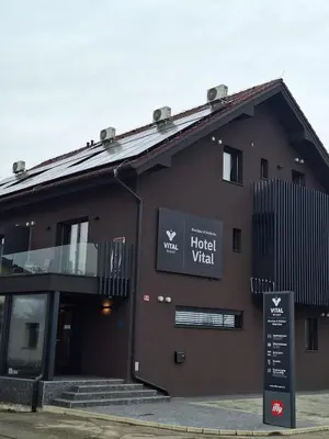 a building with a sign in front of it at Boutique & Wellness Hotel Vital in Moravske Toplice
