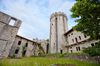 an old castle with a tower on top of it at Guesthouse Ošterija in Branik