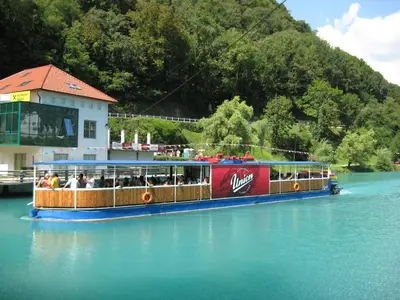 a boat filled with people on the water at Guesthouse Sobe Silva in Tolmin