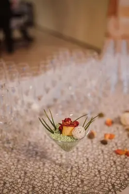 a glass vase with a dessert in it on a table at Hotel Galaksija Trebnje in Trebnje