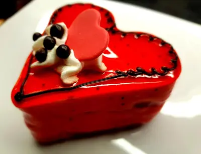 a red heart with two mice on top of it at Hotel Galaksija Trebnje in Trebnje