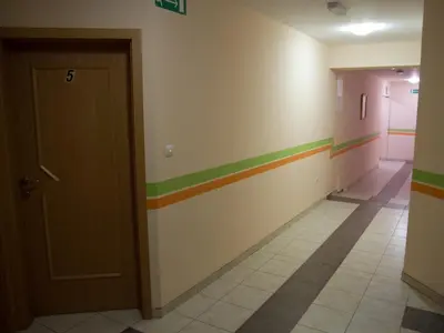 a hallway with rainbow stripes on the walls at Guest House Pri Treh Lipah in Ptuj