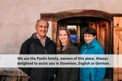 a group of people standing in front of a door at Vineyard cottage Škatlar 3 in Otočec