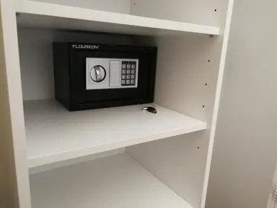 a microwave on a shelf in a kitchen at Hotel CityMap Maribor in Maribor