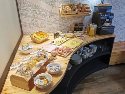a buffet with food on a table in a restaurant at Hotel CityMap Maribor in Maribor