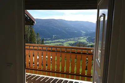 a view of a valley from a balcony at Domačija KOHOVO in Lovrenc na Pohorju